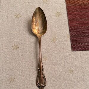 Silver overlaid Oneida spoon